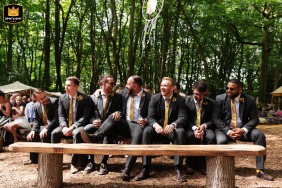 Groomsmen gather before wedding ceremony at Woodland Weddings in England.